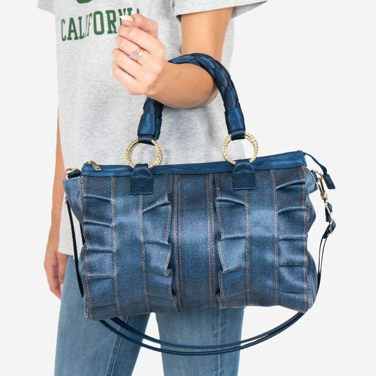 View of a Lola Satchel in Denim on a models arm