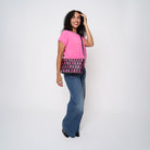A model wearing The Pink Agenda Pink Ribbon Medium Convertible Clutch