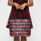 Model holding Medium Streamline Tote Shag Spooky Tiki Cocktail