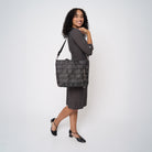 A model wearing a Black Widow Medium Streamline tote 