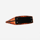 Bottom view of Medium Streamline Tote in orange tartan