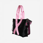 The side view of The Pink Agenda Pink Ribbon Medium Streamline Tote