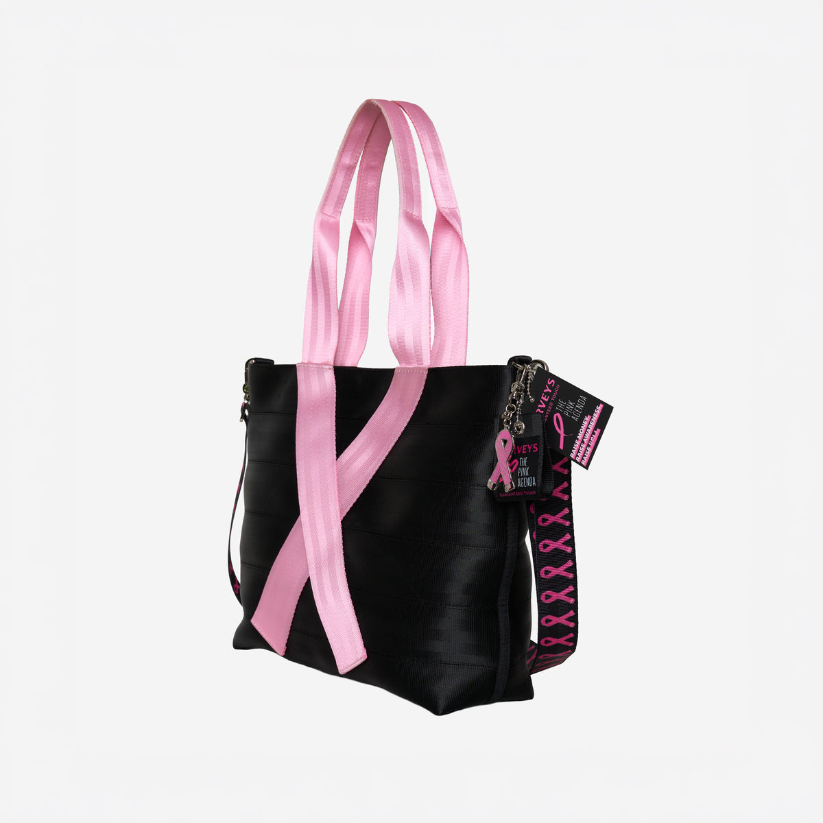 The side view of The Pink Agenda Pink Ribbon Medium Streamline Tote