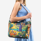 The Shag Exotica Medium Streamline Tote being held by a model