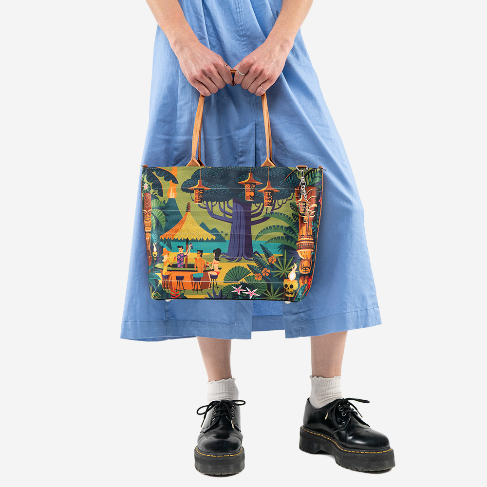 The Shag Exotica Medium Streamline Tote being held by a model