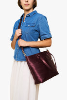Medium Streamline Tote Merlot Crossbody Side View on Model