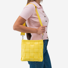 The Mini Messenger in Lemon being worn by a model