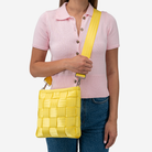 The Mini Messenger in Lemon being worn by a model