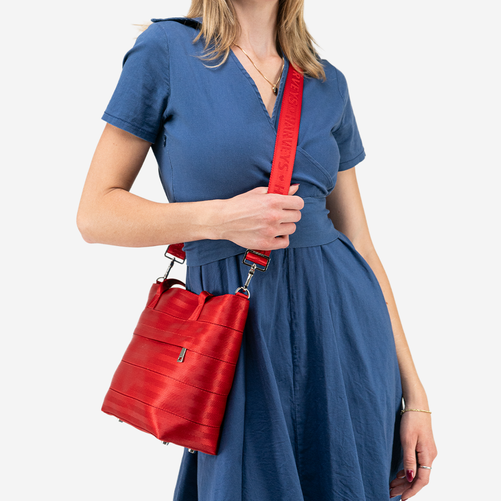The Mini Streamline Tote in Scarlet being worn by a model