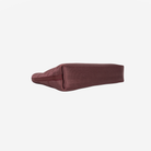 The bottom view of the Makeup Case in Merlot