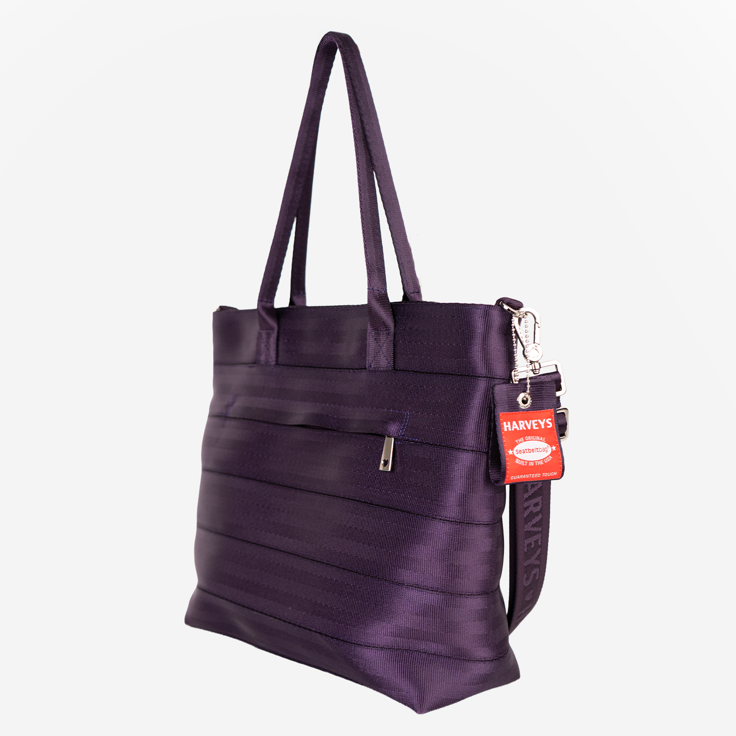 The side view of a Medium Streamline Tote in Blackberry