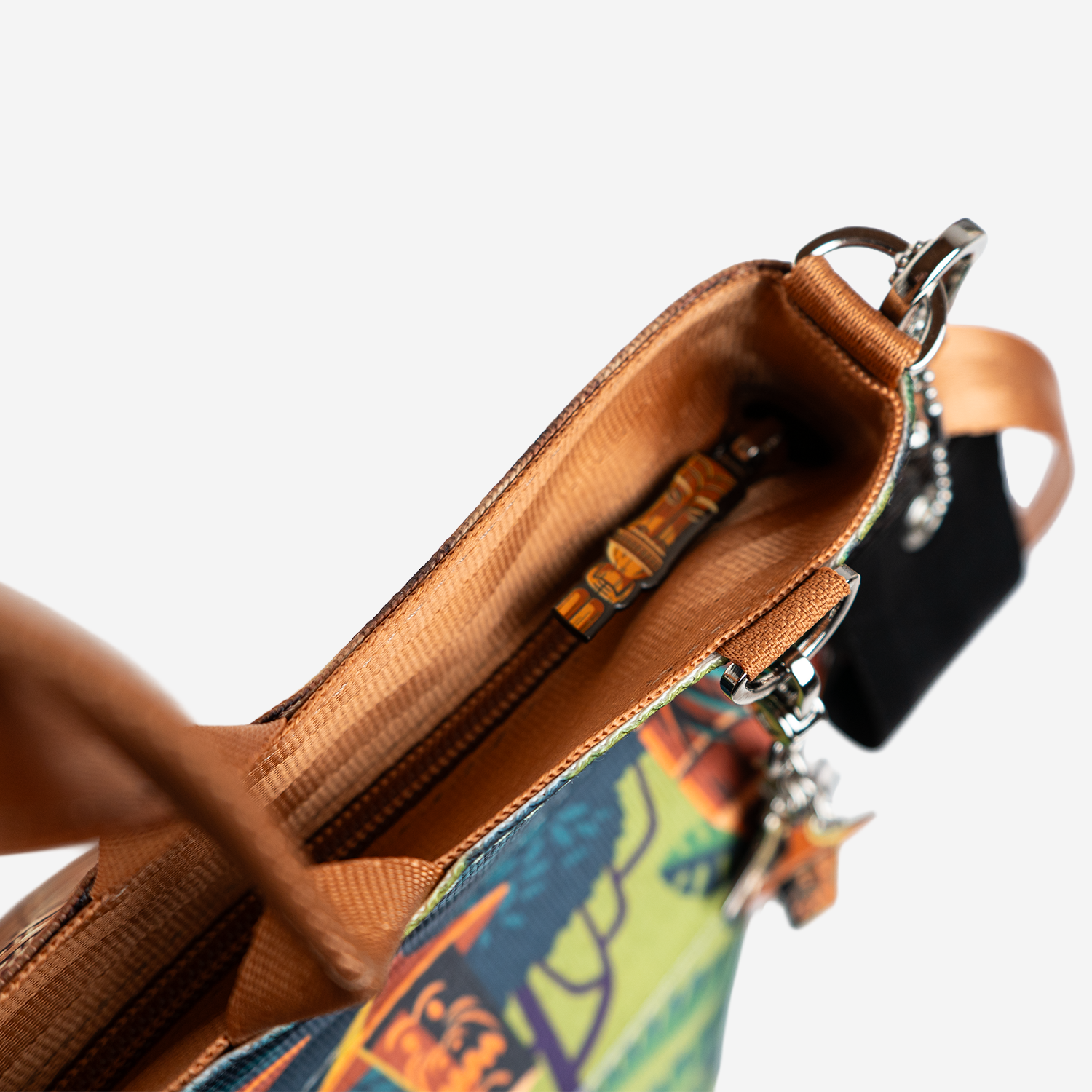 The zipper detail of a Shag Exotica Medium Streamline Tote