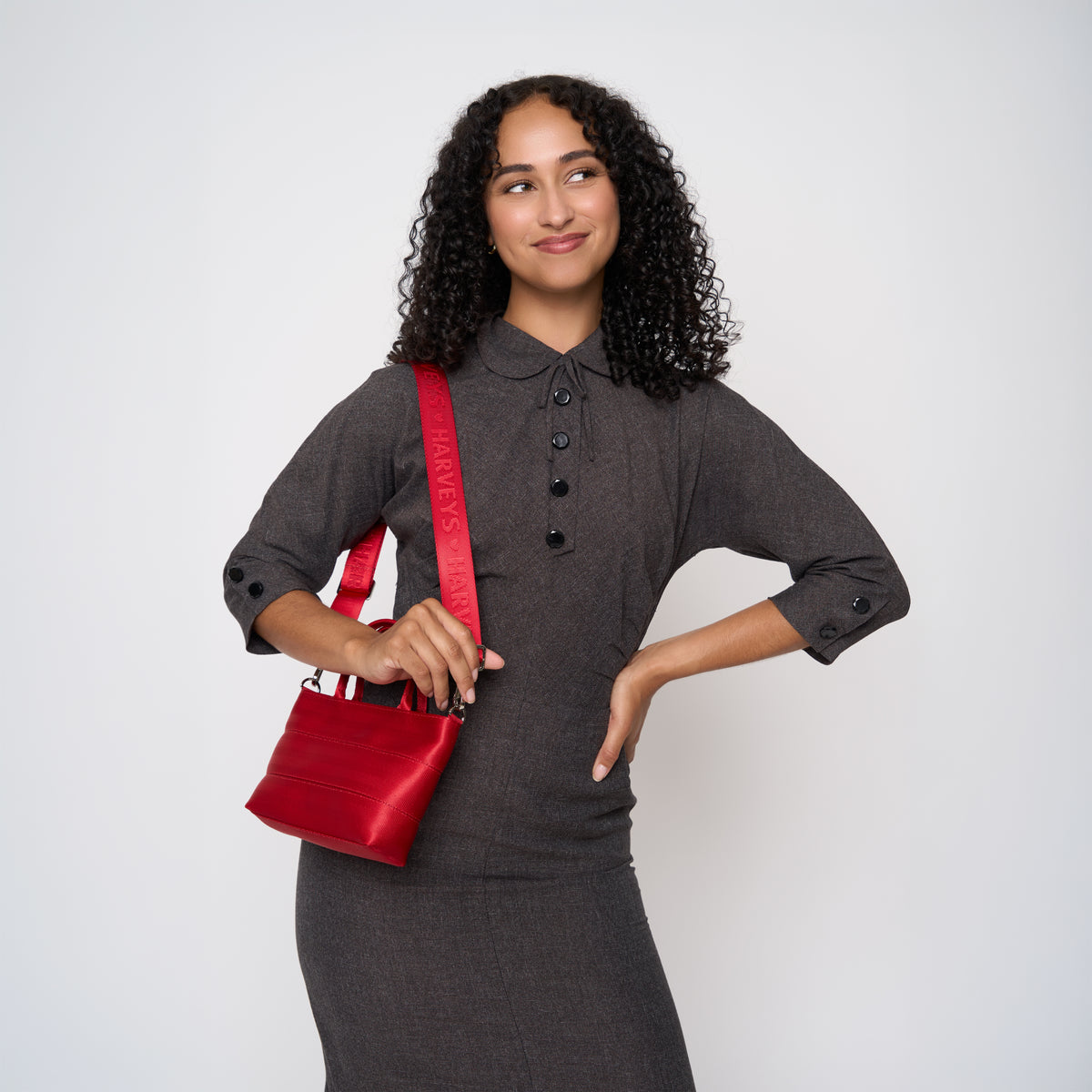 A model wearing the Scarlet Petite Tote