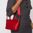 A model wearing the Scarlet Petite Tote