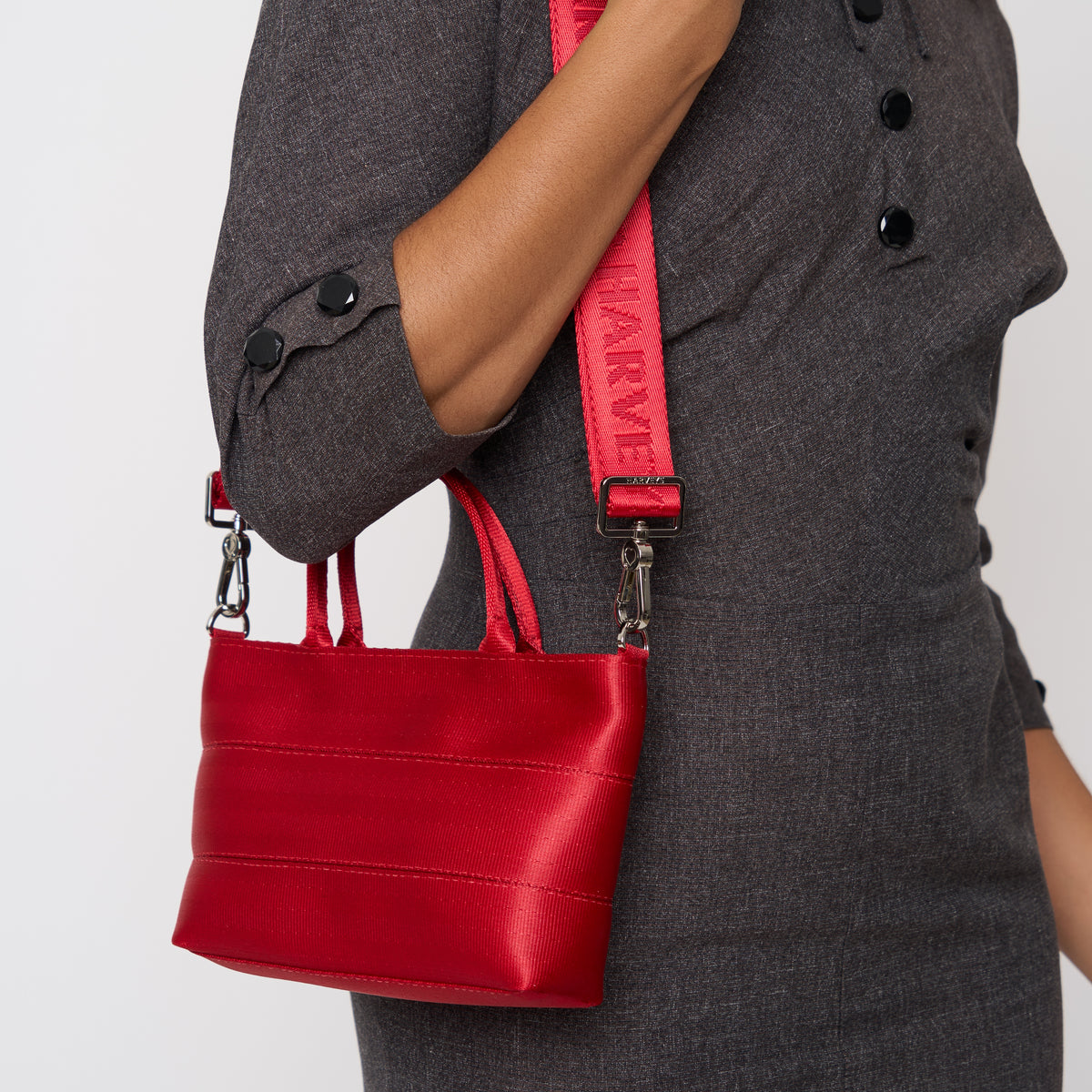 A model wearing the Scarlet Petite Tote