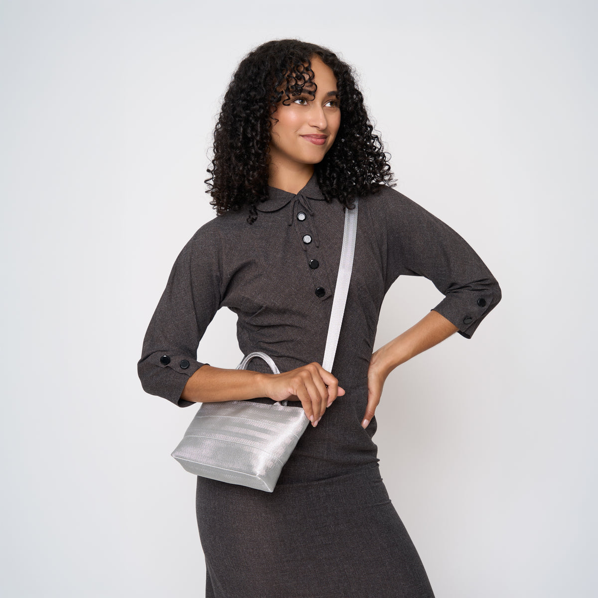 A model wearing the Silver Petite Tote