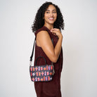 Model wearing petite tote Shag Spooky Tiki Cocktail using extendable shoulder strap