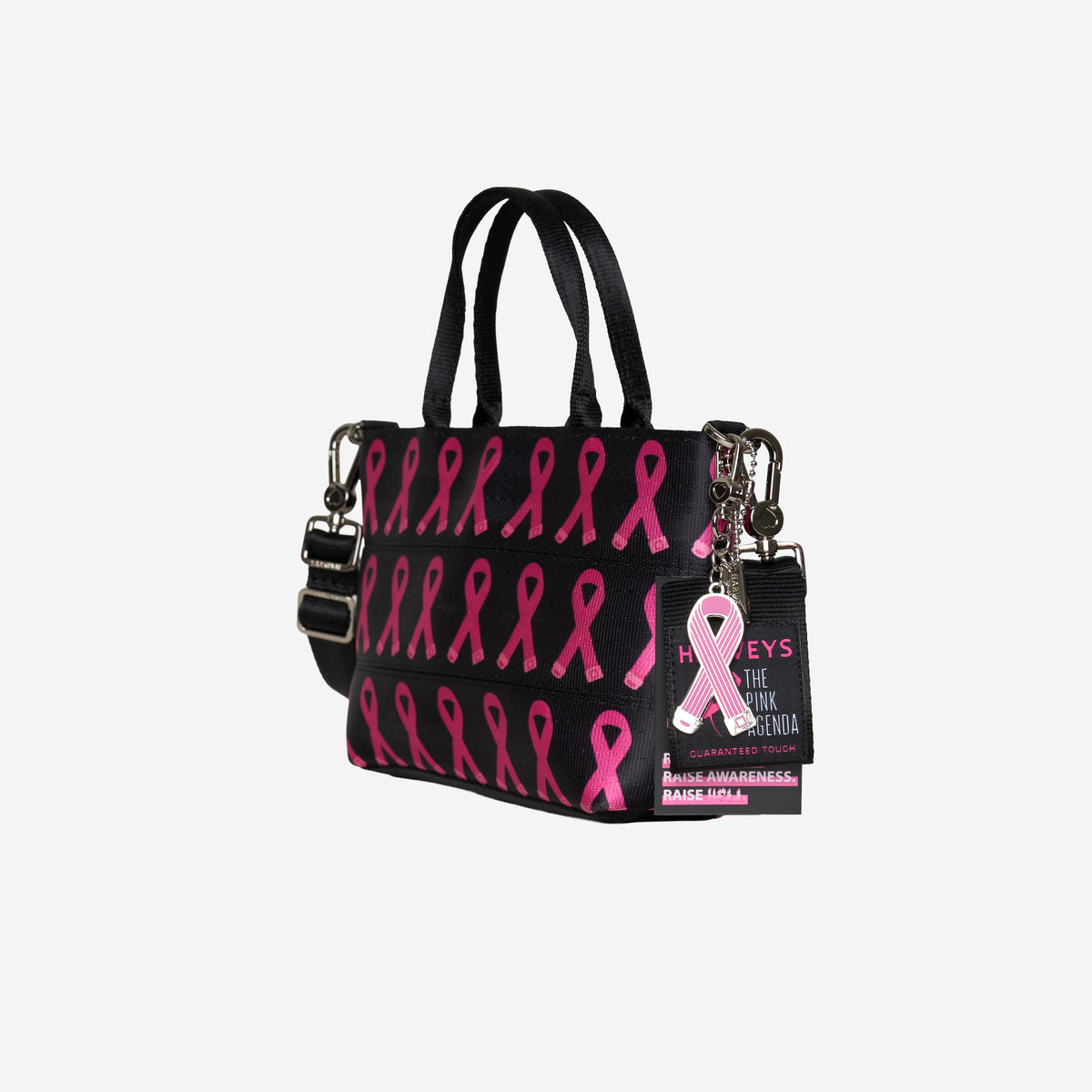 The side view of The Pink Agenda Pink Ribbon Petite Tote