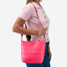 The Rosie Tote in Dragonfruit being worn by a model