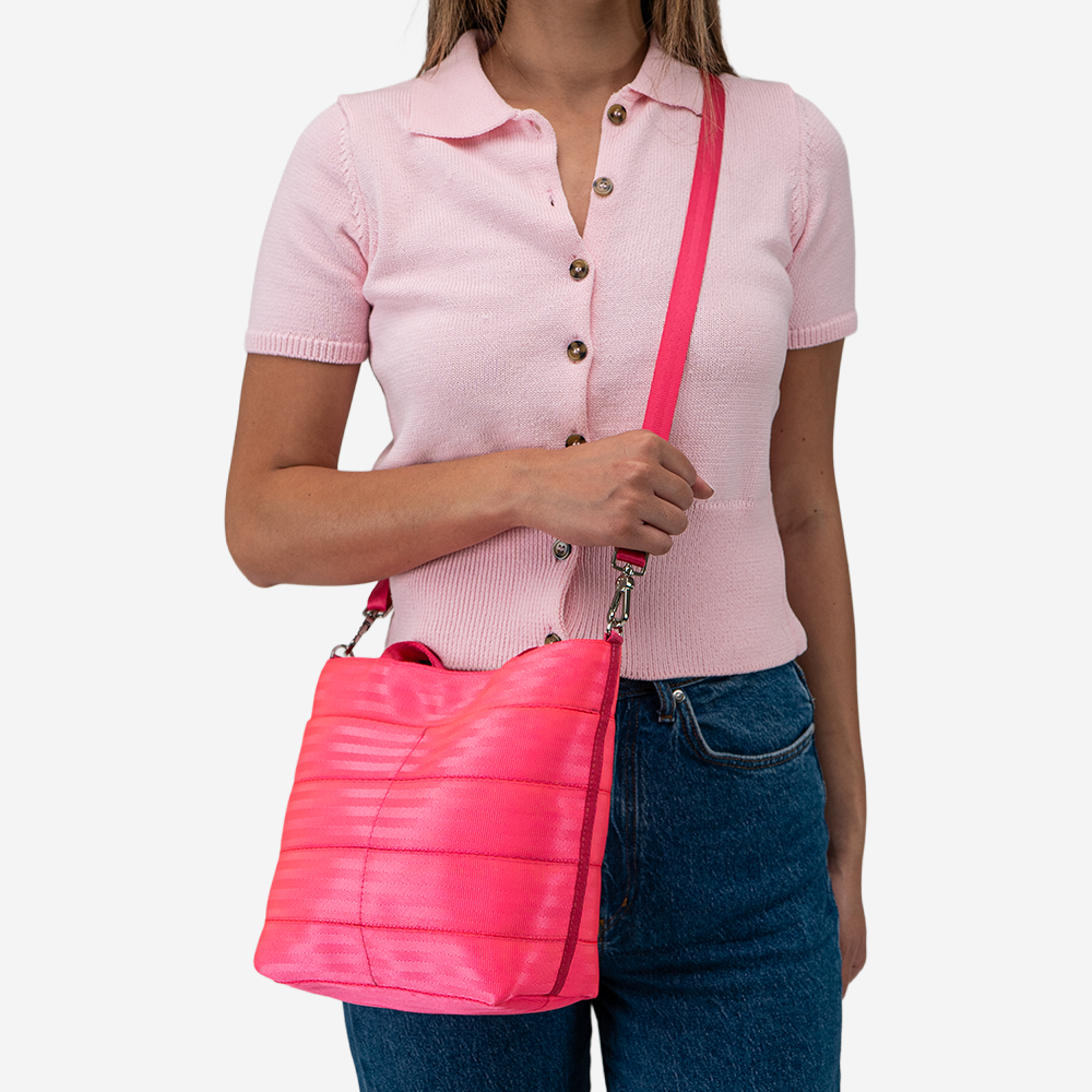 The Rosie Tote in Dragonfruit being worn by a model