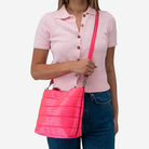 The Rosie Tote in Dragonfruit being worn by a model