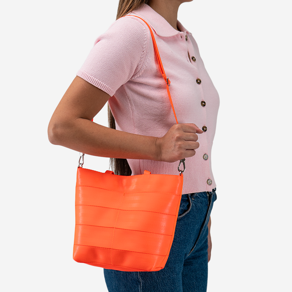 The Rosie Tote in Poppy being worn by a model