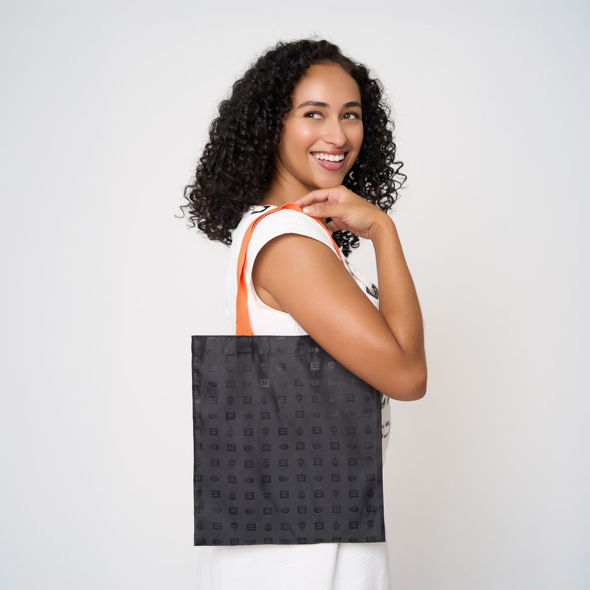 Model carrying small shopper tote in Punk'N