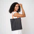 Model carrying small shopper tote in Punk'N
