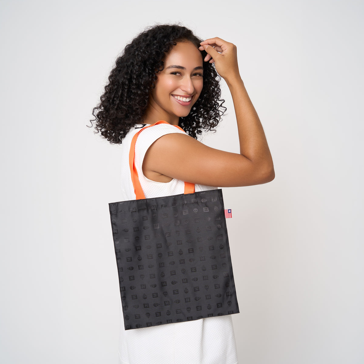 Model carrying small shopper tote in Punk'N