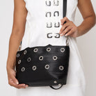 Close up of model carrying PUNK'N streamline baguette grommet using adjustable strap