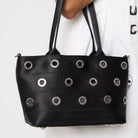 Close up of model carrying PUNK'N streamline baguette grommet on arm