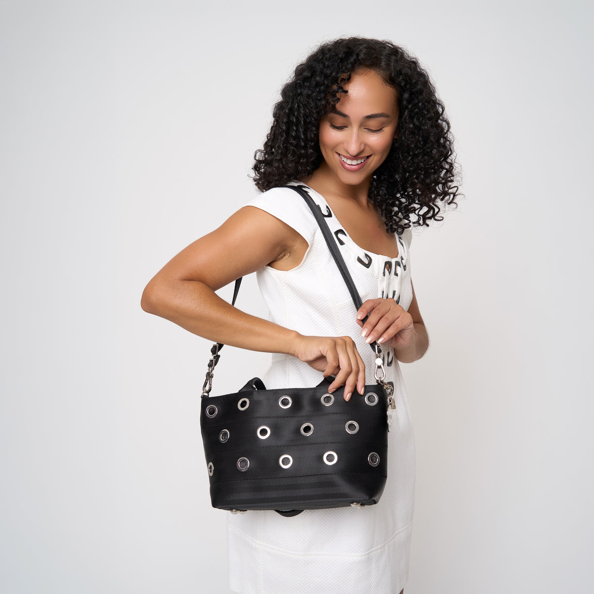 Model carrying PUNK'N streamline baguette grommet using adjustable strap