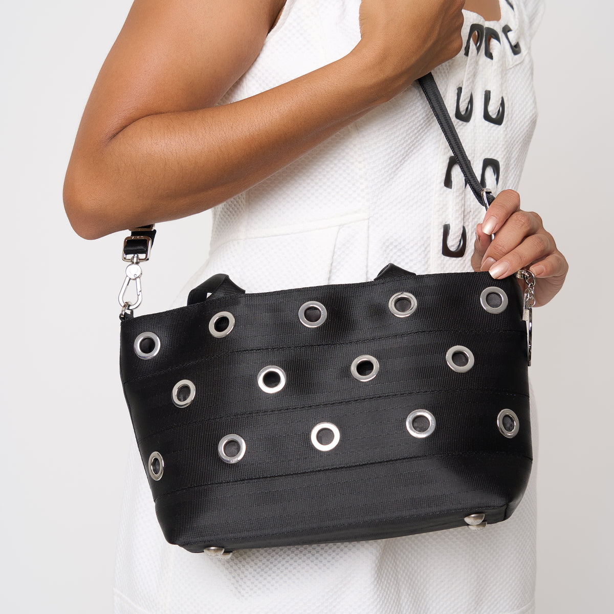 Model carrying PUNK'N streamline baguette grommet using adjustable strap