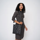 A model wearing a Black Widow Streamline Crossbody 