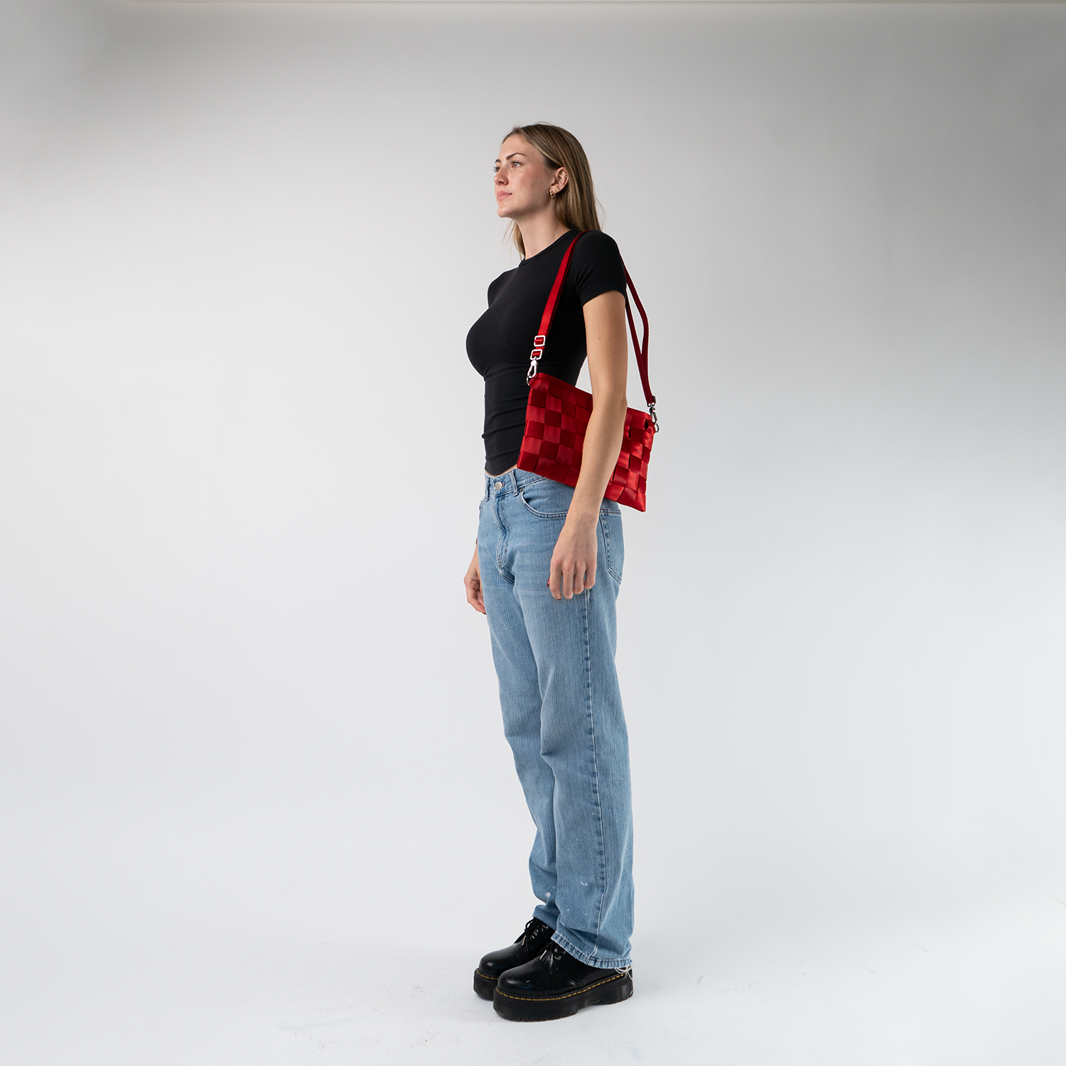 A Scarlet Large Hip Pack being worn on a models shoulder