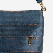 Detailed view of a Streamline Crossbody in Denim