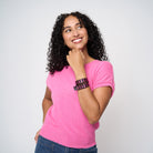 A model wearing The Pink Agenda Pink Ribbon Tuff Cuff