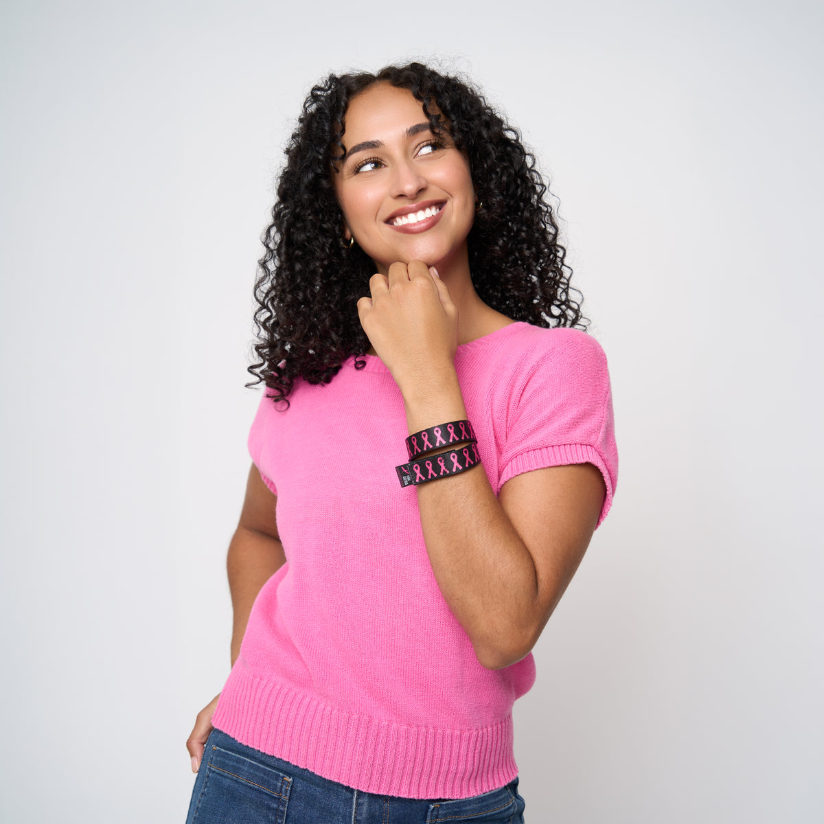 A model wearing The Pink Agenda Pink Ribbon Tuff Cuff