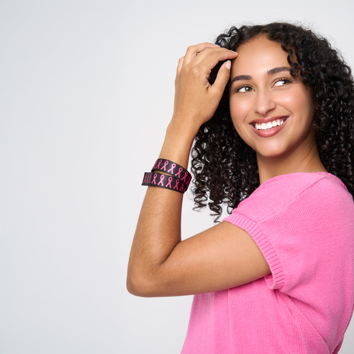A model wearing The Pink Agenda Pink Ribbon Tuff Cuff