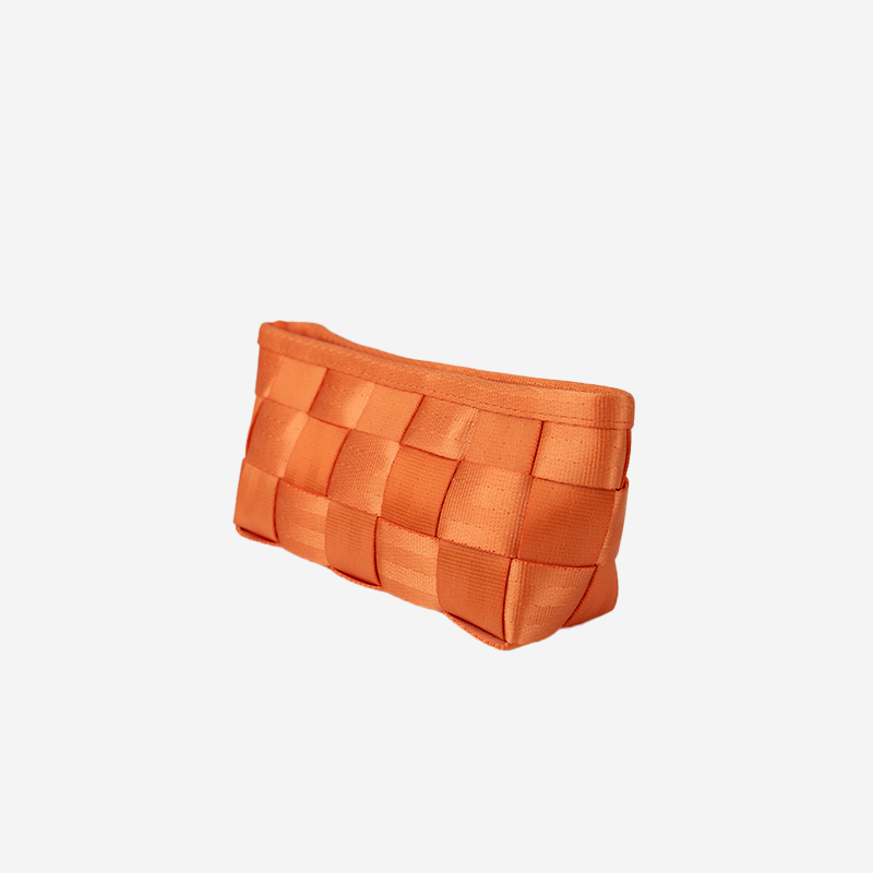 Side angle of a Triangle Makeup Case in the color Orange