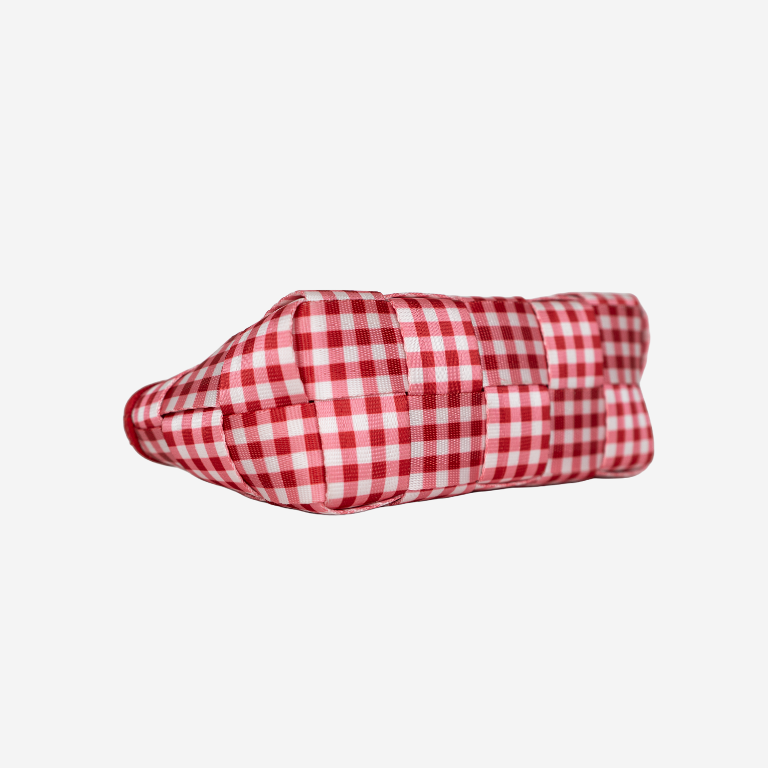 The bottom of a Triangle Makeup Case in Red Gingham
