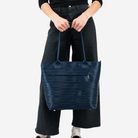 A Wanderlust in Indigo being held by a model