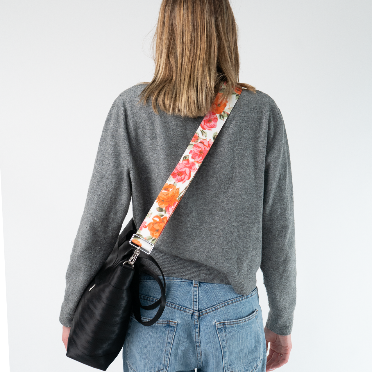 The Betty Rose 5 Panel Click N Carry being used on a bag by a model