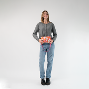 The Betty Rose Hip Pack being held in a model's hands