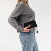 A Classic Wallet in Black being held by a model