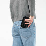 The Black Lola Fun Size Wallet being held in a model's hand