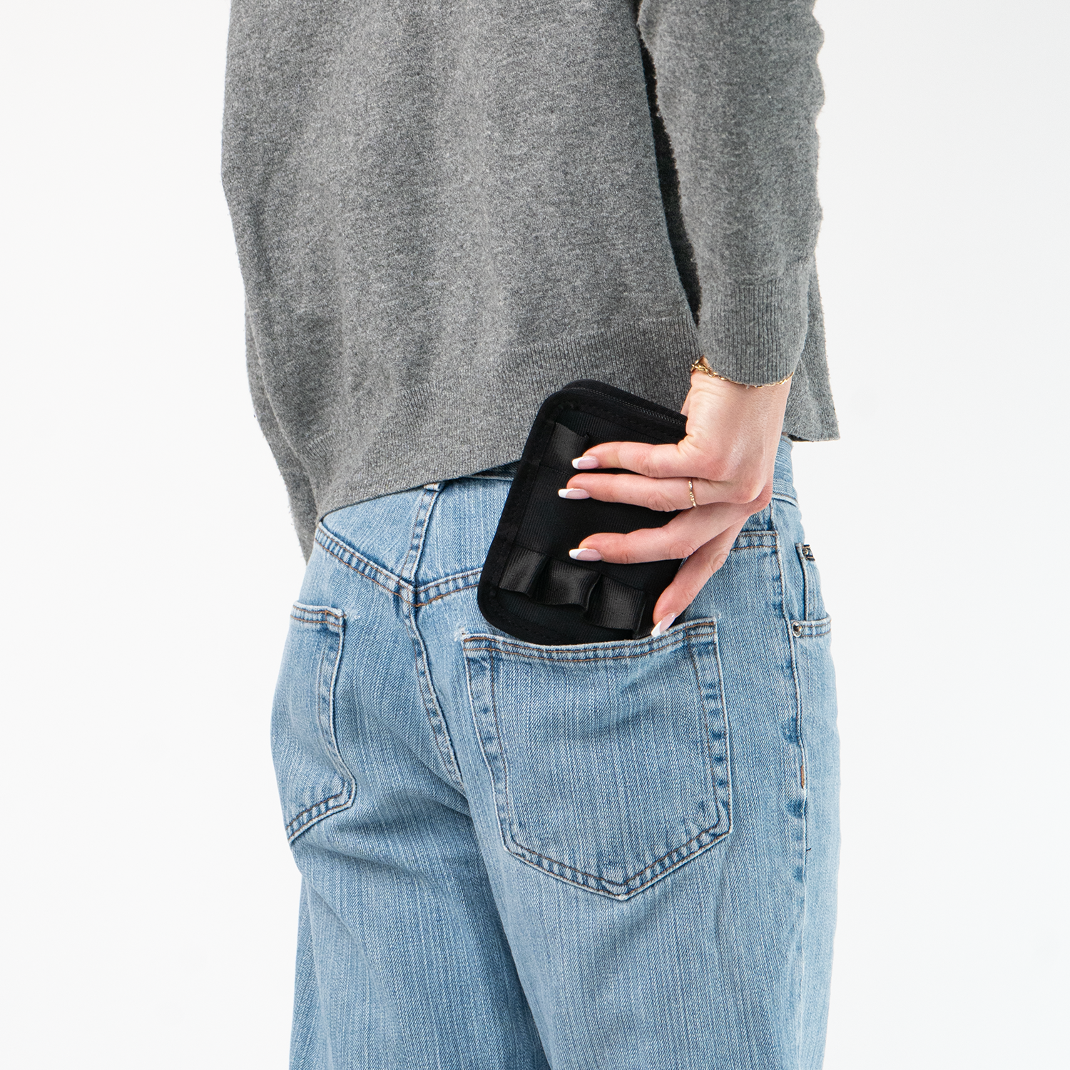 The Black Lola Fun Size Wallet being held in a model's hand