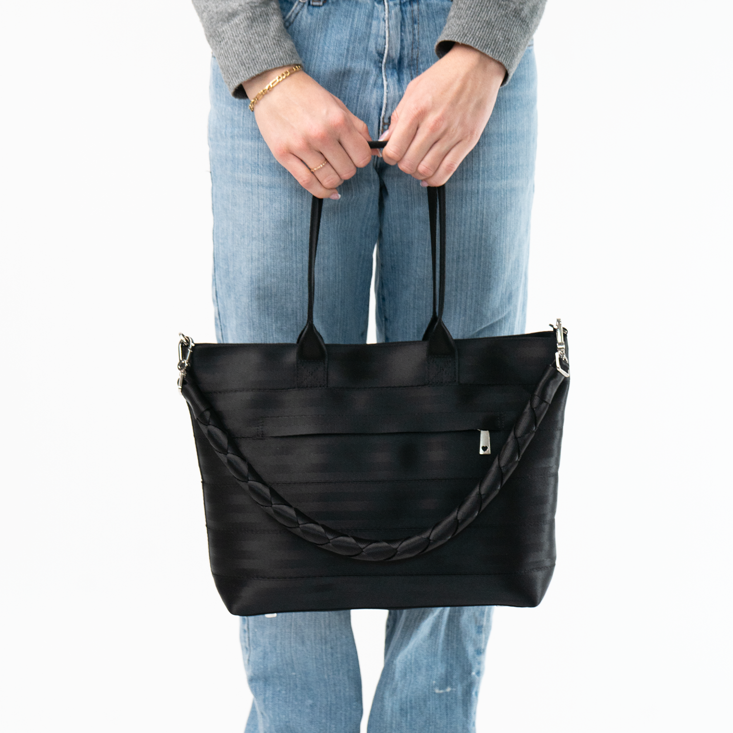 The Long Lola Click N Carry in Black being used on a bag by a model