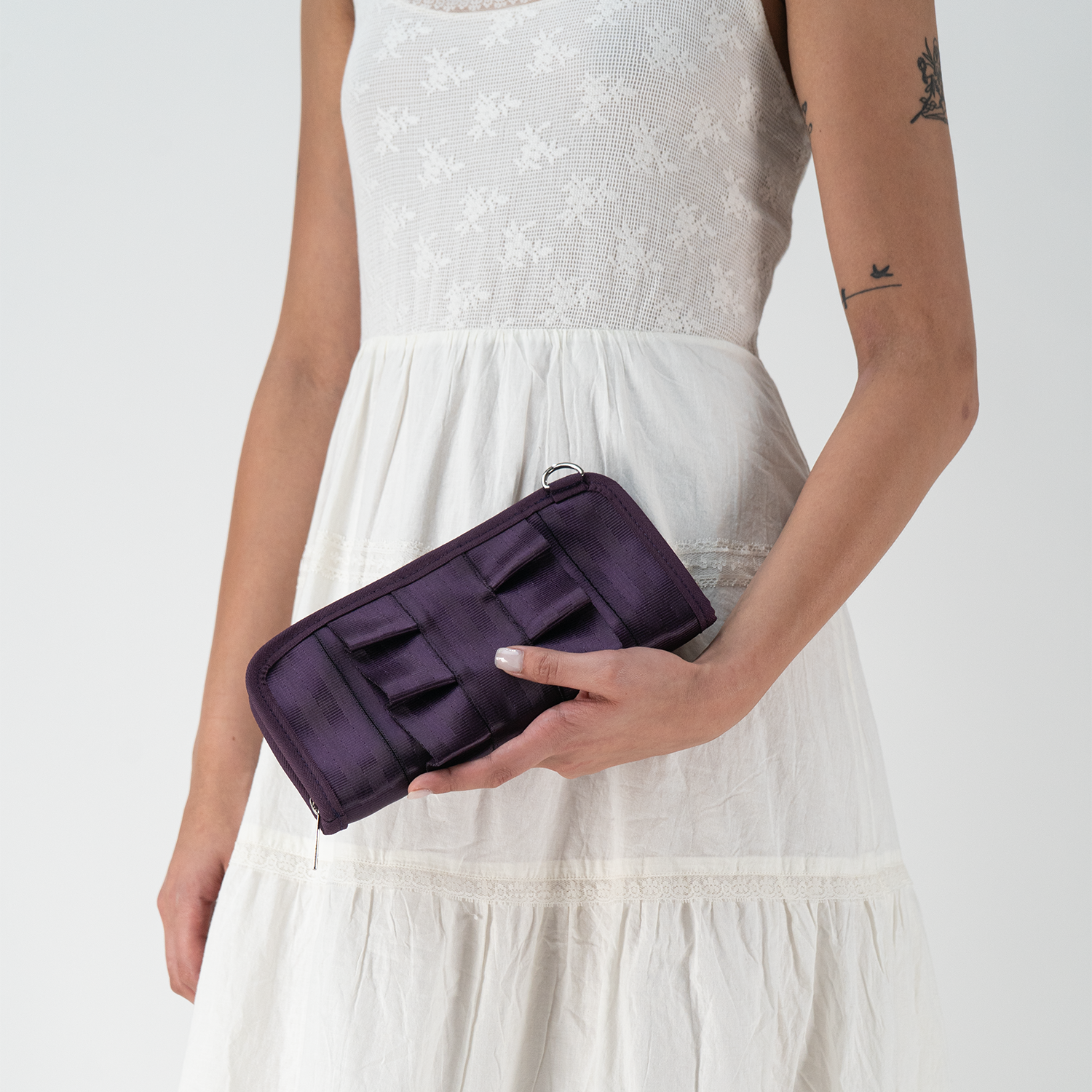 A Blackberry Lola Clutch Wallet in a models hands