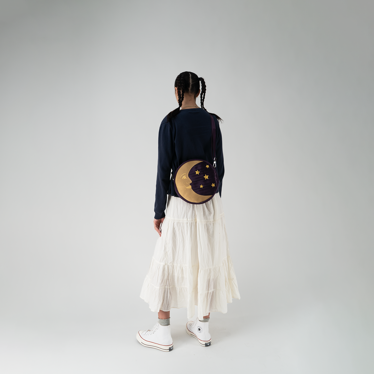 A Celestial Circle Crossbody being worn by a model